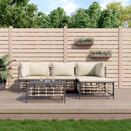 4-piece outdoor furniture lounge set with cushions on a deck, perfect for a cozy garden space.