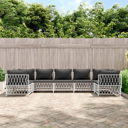 7 piece garden lounge set with black cushions and white steel frame in outdoor patio setting. Perfect outdoor furniture for relaxation.