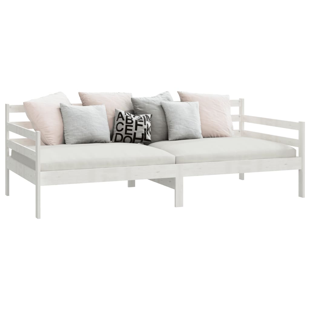 White solid pine day bed without mattress, featuring soft cushions in pastel colors, ideal for lounge and guest settings.