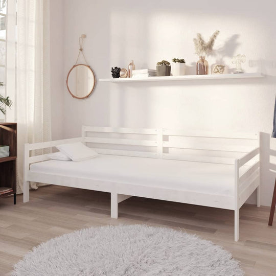 White solid pine day bed 90x200 cm in a minimalist room, ideal for lounge or guest use, combining style with comfort.