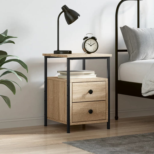 Bedside cabinet in Sonoma Oak with iron frame, featuring two drawers, lamp, and clock in modern bedroom setting.