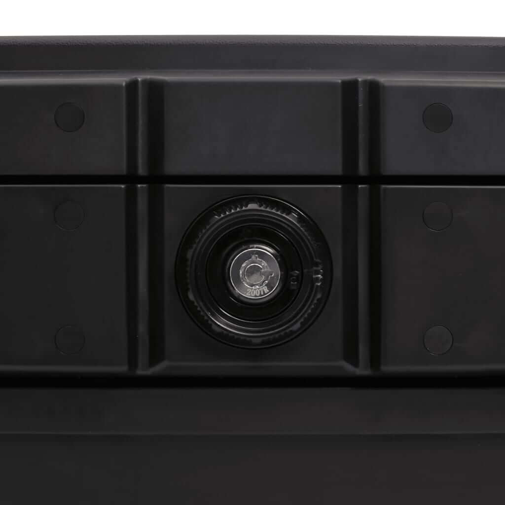 Close-up of the secure lock mechanism on a fireproof and waterproof black safe box.