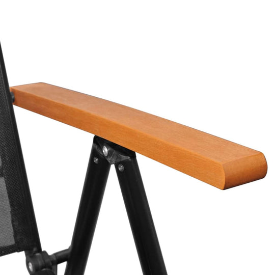 Close-up of a black and brown garden dining chair's wooden armrest, showcasing the stylish design and durable materials.