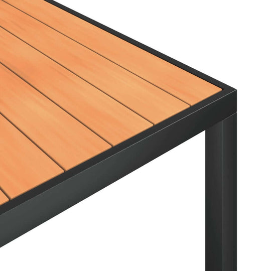 Close-up of the black aluminum frame and wooden slat top of a garden dining table.