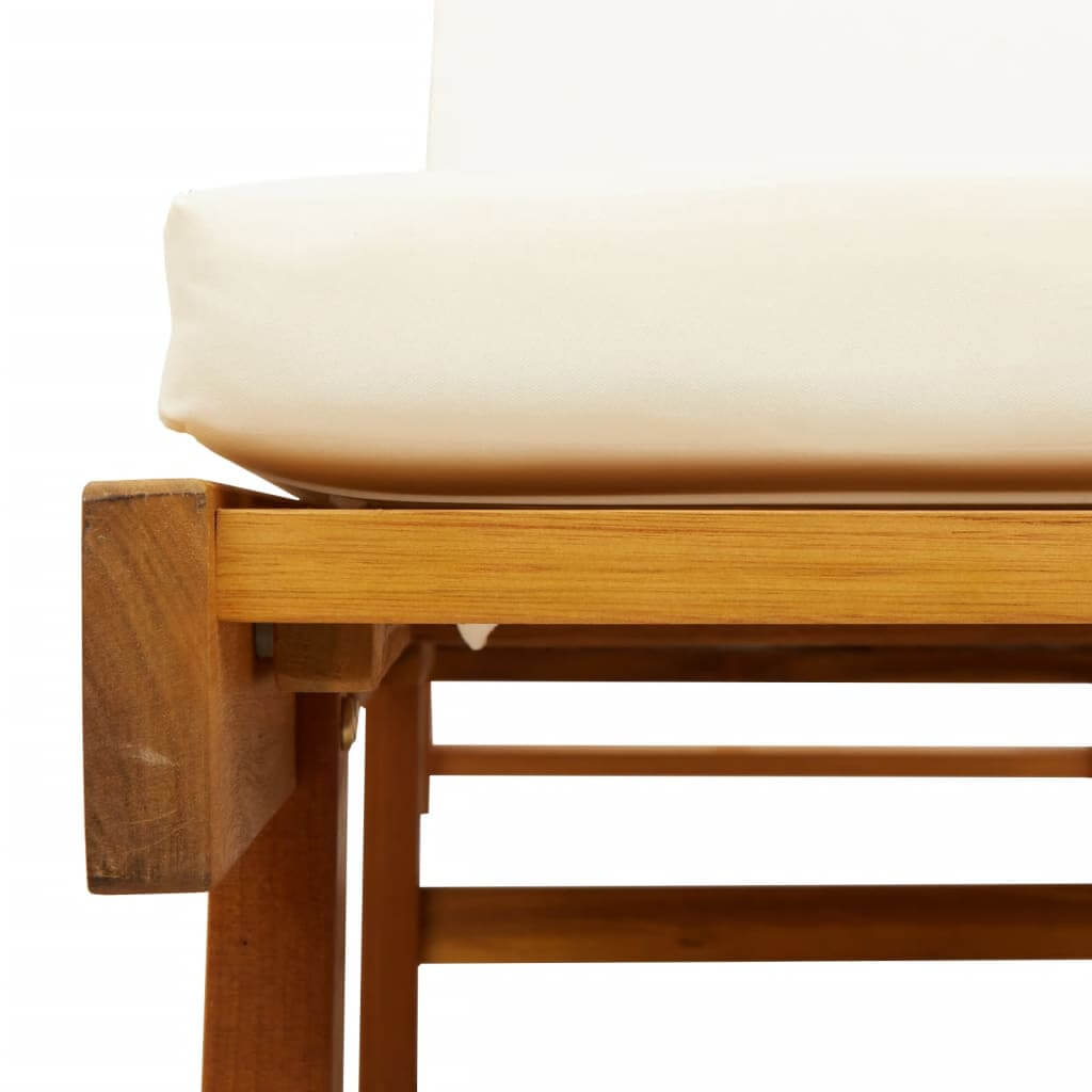 Close-up of a solid acacia wood sun lounger with a white cushion, highlighting its sturdy construction and elegant design.