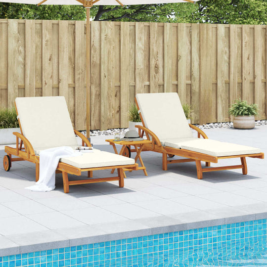 Two comfortable solid wood acacia sun loungers with cushions by a poolside, perfect for outdoor relaxation.