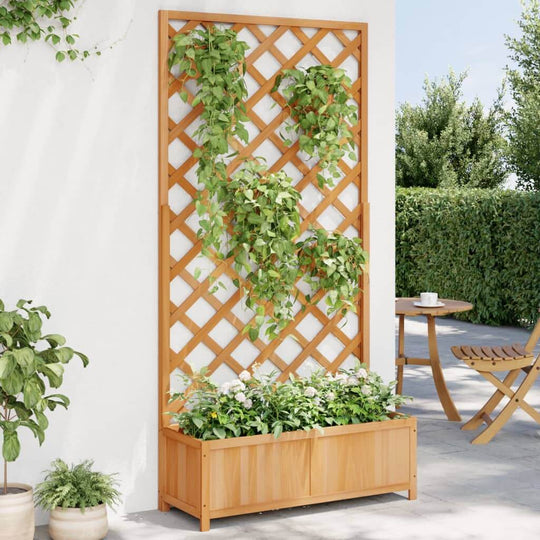 Wooden planter with trellis featuring climbing plants, ideal for outdoor furniture and garden décor.