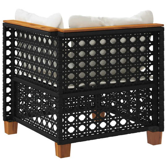 Black poly rattan garden sofa corner with cushions, perfect for outdoor lounging and furniture arrangements.