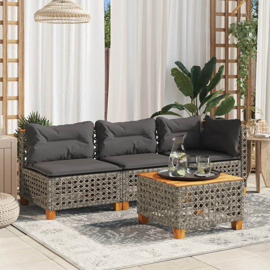 Grey poly rattan 3-seater garden sofa with cushions, stylish outdoor lounge furniture on a patio.