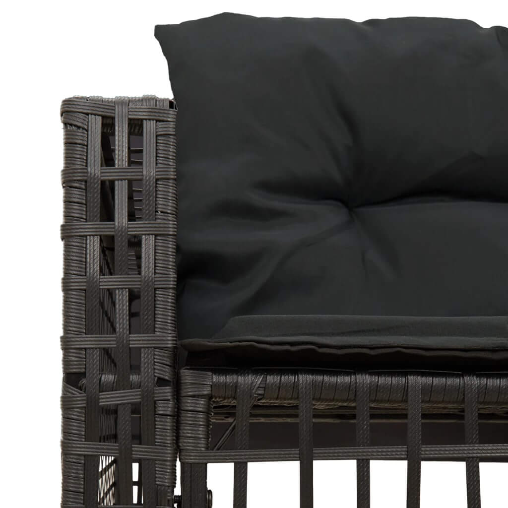 Close-up of black cushioned L-shaped garden sofa made of durable poly rattan, perfect for outdoor lounging and relaxation.