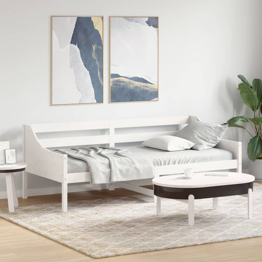 Stylish white day bed with decor, perfect for lounge or guest room use, showcasing solid pine wood in modern setting.