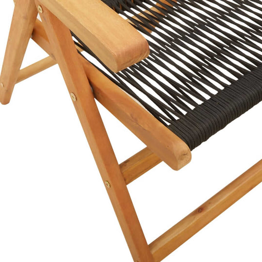 Close-up of a reclining garden chair with solid acacia wood frame and woven black seat, ideal for outdoor furniture.