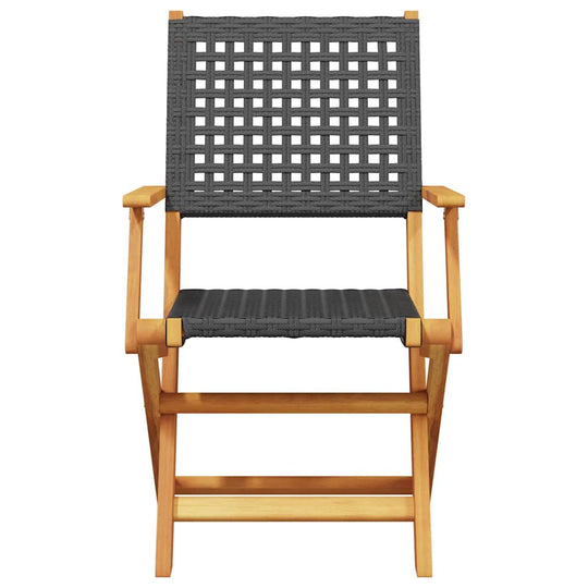 Comfortable folding garden chair made of black poly rattan and solid acacia wood, perfect for outdoor furniture.