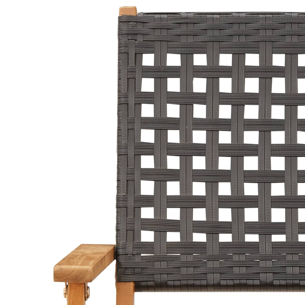 Close-up of black poly rattan weave and solid acacia wood armrest of a folding garden chair for outdoor furniture.