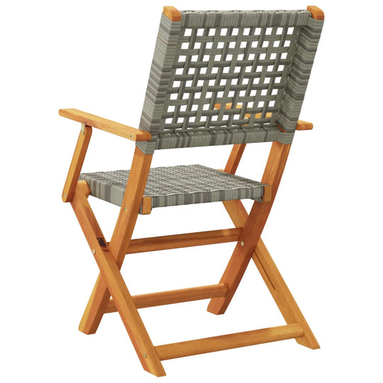 Folding garden chair with grey poly rattan seat and solid acacia wood frame, perfect for outdoor lounging and relaxation.