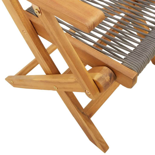 Detail view of a grey folding garden chair made of solid acacia wood, showcasing its durable design and comfortable seating.