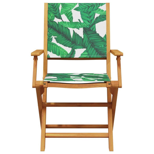 Folding garden chair with green leaf fabric and solid wood frame, ideal for outdoor relaxation and dining.