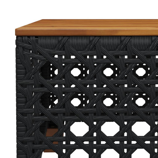 Close-up of a black poly rattan garden furniture piece with a wooden top, showcasing intricate weaving design for outdoor spaces.