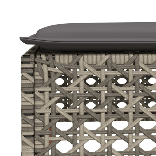 Close-up of the modern grey poly rattan texture with cushion on a garden sofa set, showcasing outdoor furniture design.