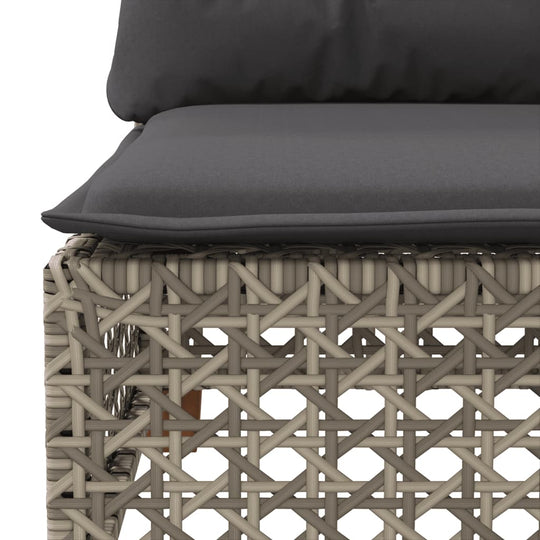 Close-up of grey cushion on a poly rattan garden sofa, showcasing durable outdoor furniture design.