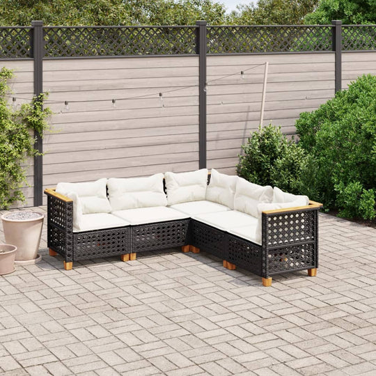 5 piece black poly rattan garden sofa set with cushions, perfect for outdoor lounging on patio or terrace.