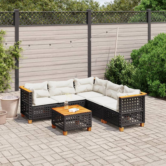 6 piece black poly rattan garden sofa set with cushions and wooden coffee table in outdoor patio setting.