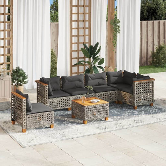 7 Piece grey poly rattan garden sofa set with cushions, perfect outdoor lounge furniture for patios and backyards.