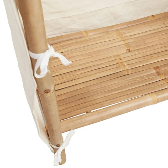 Close-up of bamboo wardrobe shelf showcasing lightweight bamboo construction and practical fabric cover ties.