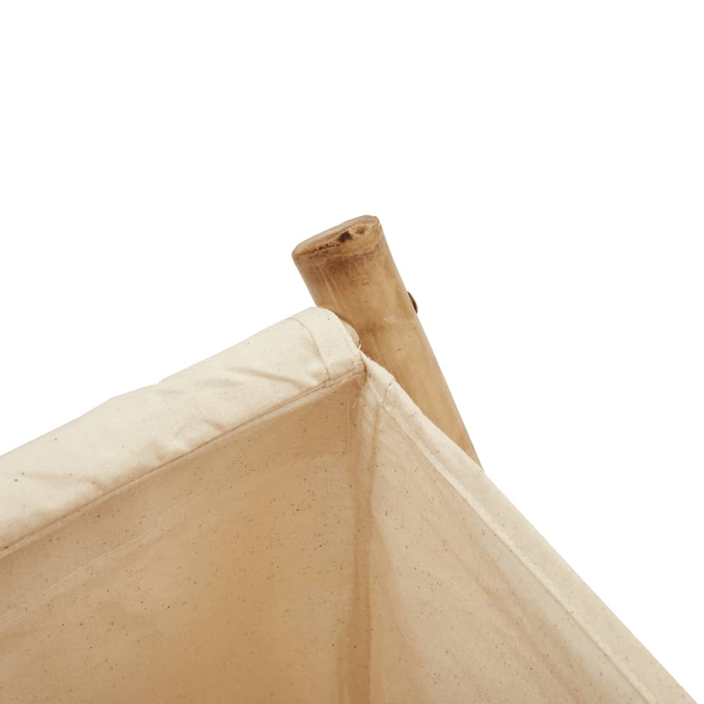 Close-up of a cream white bamboo laundry basket showcasing its durable fabric and wooden handle for stylish laundry storage.