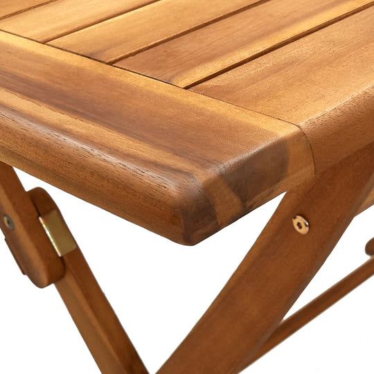 Close-up of solid acacia wood tabletop, showcasing unique grain patterns and durable finish for outdoor furniture.