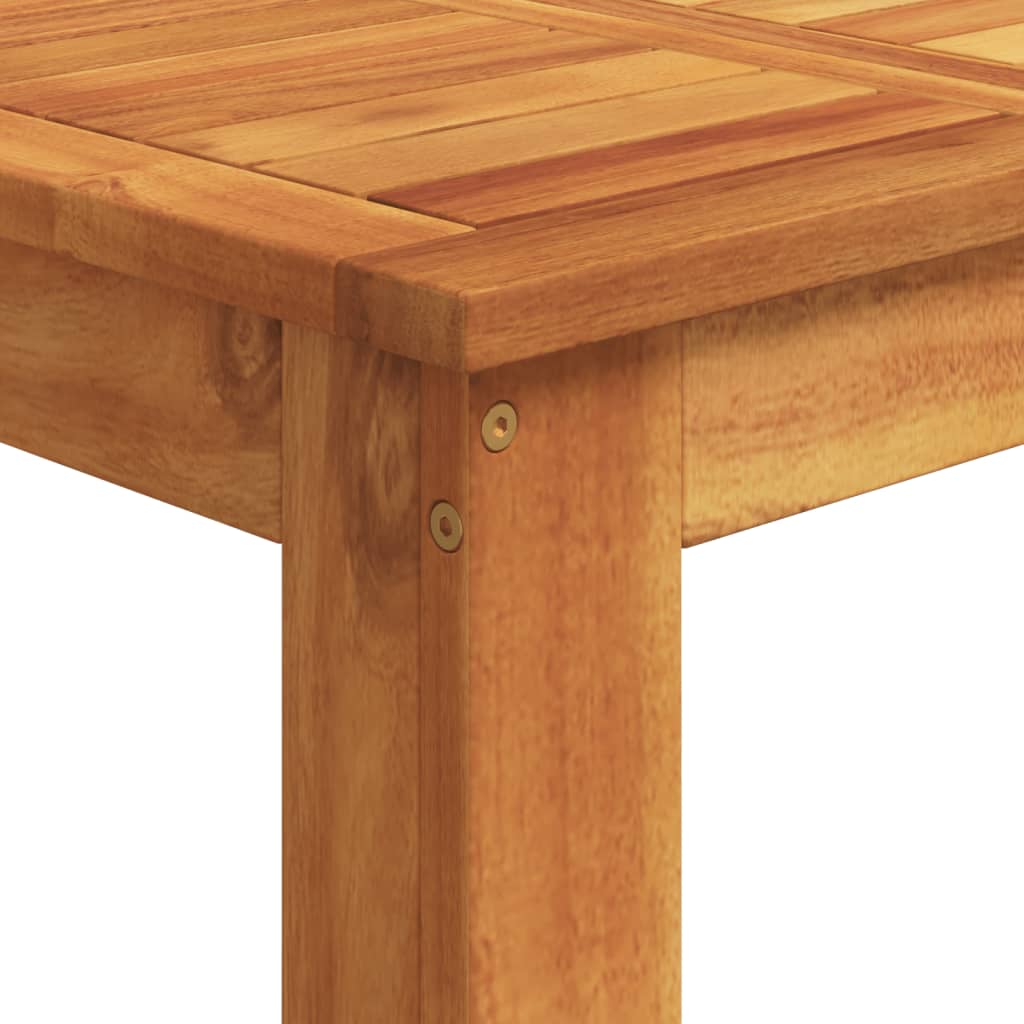 Close-up of a solid wood acacia table showing a sturdy leg and slatted top design, ideal for outdoor furniture and lounge settings.