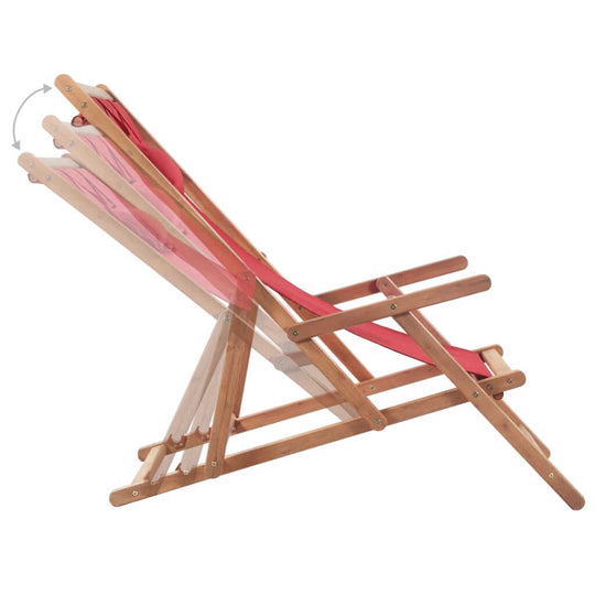 Adjustable folding beach chair with wooden frame and red fabric, perfect for outdoor relaxation.